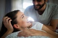 Cheerful young couple making massage at home Royalty Free Stock Photo