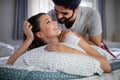 Cheerful young couple making massage at home Royalty Free Stock Photo