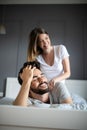 Cheerful young couple making massage at home Royalty Free Stock Photo