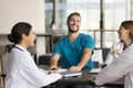 Cheerful young Indian doctor woman laughing at professional meeting Royalty Free Stock Photo