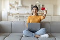 Cheerful young indian woman showing credit card at camera Royalty Free Stock Photo