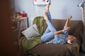 Cheerful young lady listening music and having fun at home Royalty Free Stock Photo