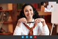 Cheerful young lady studying English, having video call with tutor Royalty Free Stock Photo