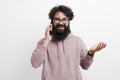 Cheerful young man with beard talking with mobile phone Royalty Free Stock Photo