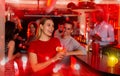 Young man flirting with women bar counter and drinking cocktails Royalty Free Stock Photo