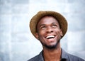 Cheerful young man laughing and looking up Royalty Free Stock Photo
