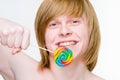 Cheerful young man with lollipop Royalty Free Stock Photo