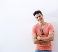 Cheerful young man smiling with arms crossed Royalty Free Stock Photo