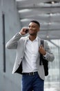 Cheerful young man talking on mobile phone Royalty Free Stock Photo