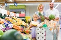 Family choosing fruits in hypermarket. Royalty Free Stock Photo