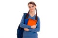 Cheerful young student girl with backpack and books looking at the camera and smiling isolated on white background Royalty Free Stock Photo
