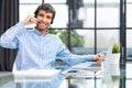 Cheerful young support phone male operator in headset, at workplace while using computer, help service and client Royalty Free Stock Photo