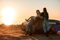 Cheerful young three women standing near cabriolet Royalty Free Stock Photo