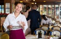 Waitress satisfied with good tip from guests