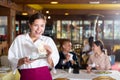 Waitress satisfied with good tip from guests