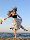 Cheerful young woman at the beach