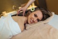 Young woman is enjoying back stone massage at spa Royalty Free Stock Photo