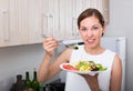 smiling woman eating salad Royalty Free Stock Photo