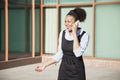 Cheerful young woman in formals using mobile phone Royalty Free Stock Photo