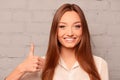 Cheerful young woman gesturing `LIKE`, close up photo Royalty Free Stock Photo