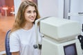 Cheerful young woman having eye examining in clinic Royalty Free Stock Photo