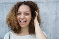 Cheerful young woman laughing