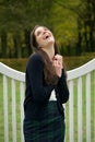 Cheerful young woman laughing outdoors in the park Royalty Free Stock Photo