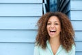 Cheerful young woman laughing outdoors Royalty Free Stock Photo