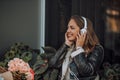 Cheerful young woman listening music via headphones and enjoy Royalty Free Stock Photo