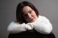 Cheerful young woman looking at camera, smiling on gray background. Close up of female face. Natural beauty Royalty Free Stock Photo