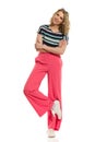 Cheerful Young Woman In Loose Pink Pants Royalty Free Stock Photo