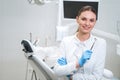 Smiling pretty dentist with tools stock photo Royalty Free Stock Photo