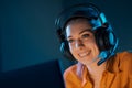 Cheerful woman playing video games online