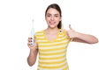 cheerful young woman point finger on electric toothbrush isolated on white background Royalty Free Stock Photo