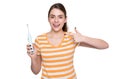cheerful young woman pointing finger on electric toothbrush isolated on white background Royalty Free Stock Photo