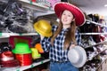 Woman choosing funny headdresses in store Royalty Free Stock Photo