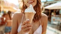 Cheerful young woman savoring a delicious ice cream, capturing the essence of summer