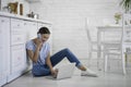 Gladsome woman talking on the phone and using laptop stock photo