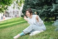 A young woman eating sushi in the park, picnic in nature. Royalty Free Stock Photo