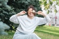 A young woman eating sushi in the park, picnic in nature. Royalty Free Stock Photo