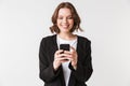 Cheerful young woman standing isolated chatting Royalty Free Stock Photo