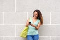 Cheerful young woman texting Royalty Free Stock Photo