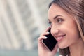 Cheerful young woman is using phone for Royalty Free Stock Photo