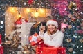 Cheerful young woman wearing christmas costume over wooden wall. Winter holidays and people concept. True Emotions Royalty Free Stock Photo