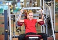 Cheerful young woman working out in gym Royalty Free Stock Photo