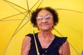 Portrait mature brazilian woman using umbrella