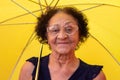 Portrait mature brazilian woman using umbrella