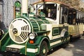 Cheerfully painted children`s train for walks in the amusement park