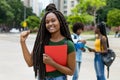 Cheering african american female student with amazing hairstyle Royalty Free Stock Photo