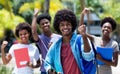 Cheering african american university student with group of african american students